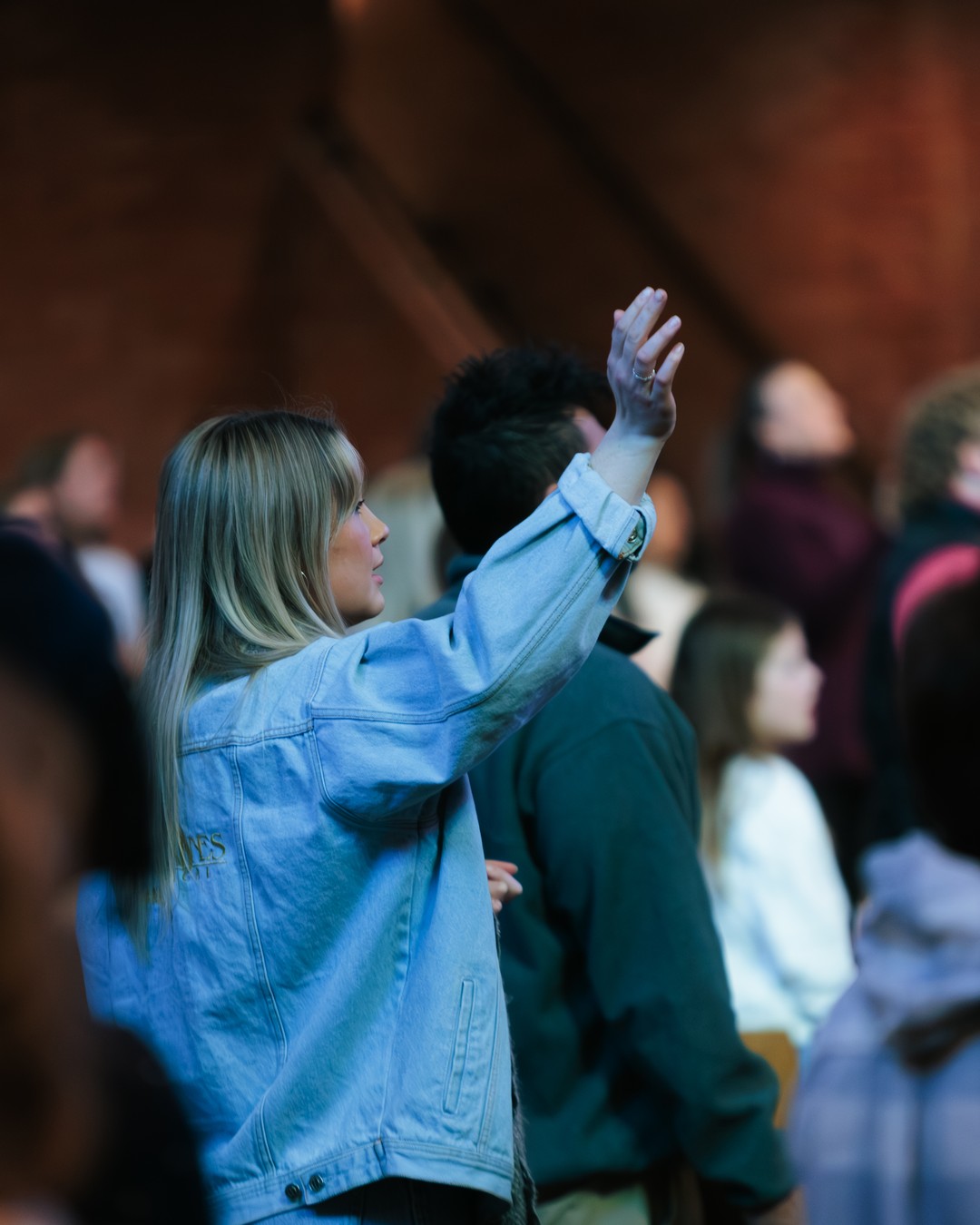 A member of the Nashville First congregation worshiping during a service